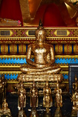 Golden statue of buddha in temple, Thailand	