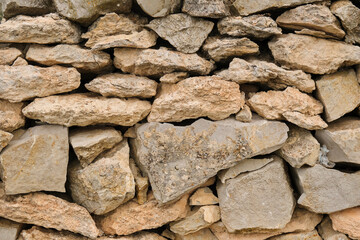 Wall made of stones and rocks. Stones texture background
