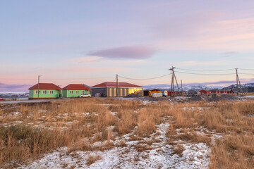 Fototapeta premium Guest houses on the shore of the Barents Sea. Teriberka.