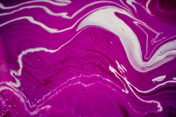 Fluid art texture. Closeup abstract dark pink, white and grey colors mixing of acrylic for use as background. Liquid acrylic artwork that flows and splashes with marble pattern