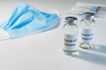 Vials with the covid-19 vaccine. Vaccination of the population against coronovirus.