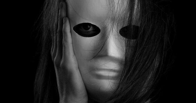 portrait of a woman wearing a white mask