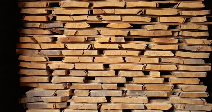 Pile of raw wooden planks drying at the drying cabinet at the warehouse