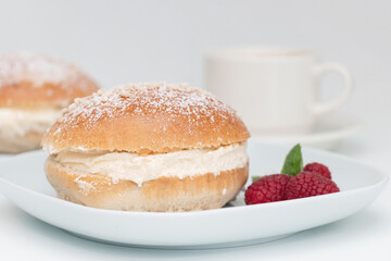 Traditional Scandinavian sweet buns with strawberry jam and whipped cream, Shrove Tuesday. Laskiaispulla, semla, semlor, vastlakukkel.
