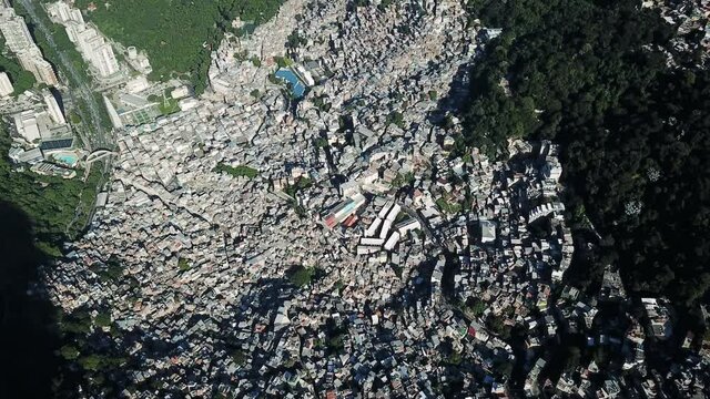 Drone aerial footage of Rocinha favela with Dois irm&atilde;os mountain in Rio de Janeiro , Brazil. City Landscape and city footage.