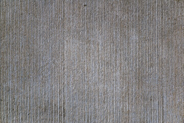 Fluted surface, vertically grooved from rough concrete, rough surface
