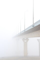 white bridge in the fog