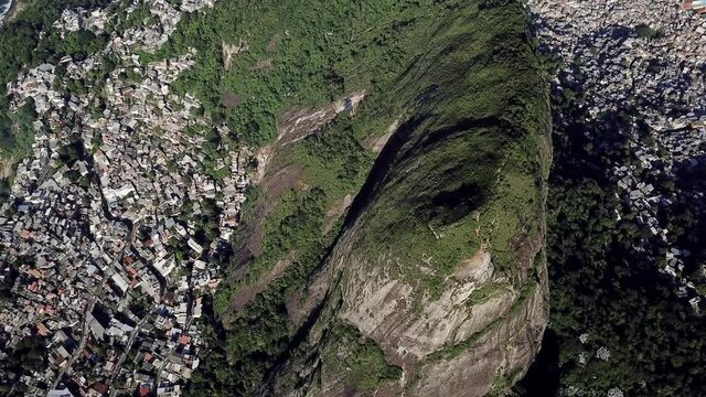 Drone aerial footage of Vidigal and Rocinha favelas with Dois irm&atilde;os mountain in Rio de Janeiro , Brazil. City Landscape and city footage.