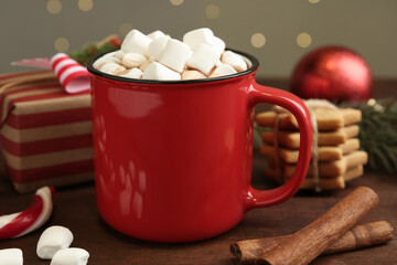 Composition with delicious marshmallow cocoa on wooden table