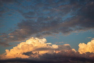 Dramatic sky before storm. Cumulonimbus during sunset. Top of cumulus clouds