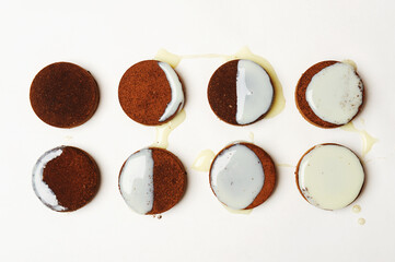 Moon phase diagram laid out of coffee espresso pucks and milk on white background. Top view, isolated