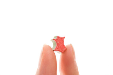 Ecstasy pill in female hand.