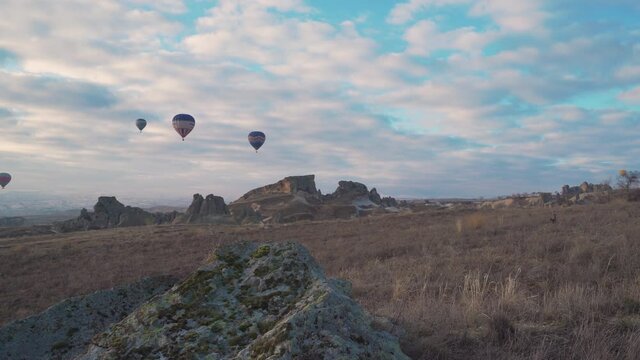 Amazing view of fairy chimneys. Flight hot air balloons in Cappadocia.4K Footage
