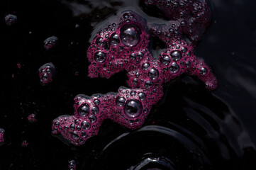 Wine making. Fresh grape juice with foam. Must flows and is collected in a special container.Technology of wine production in Moldova. The  ancient folk tradition of grape processing. Harvest home.