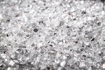 Closeup abstract broken cracked glass. Broken glass background. Shards. Looks like coal