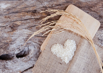 heart shaped rice on wooden background