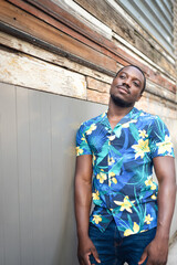 A young black man in street. Outdoor portrait of traveler. Portrait of a young african man in city. Outdoors portrait.