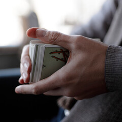 Man holding a deck of tarot cards