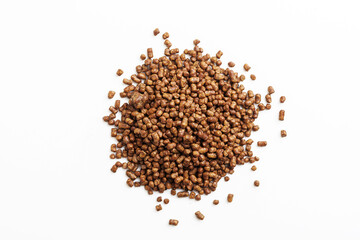  A heap of buckwheat tea on an isolated white background.