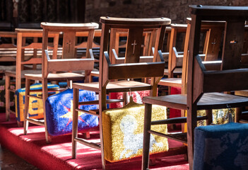 Church chairs in Cockington parish church in Cockington Court, Devon