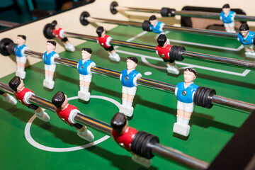 football game, Soccer table with red and blue players.dolls of a retro games.Football players miniatures from the kicker table game