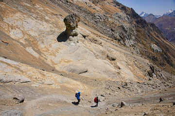 Trekkers descending from Cuyoc Pass, Cordillera Huayhuash, Ancash, Peru