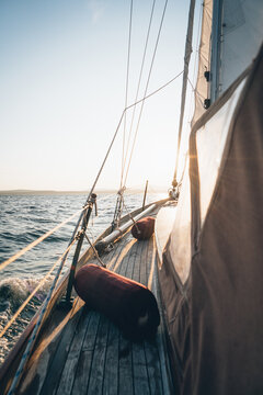 The deck of a sailboat sailing in Maine during late day
