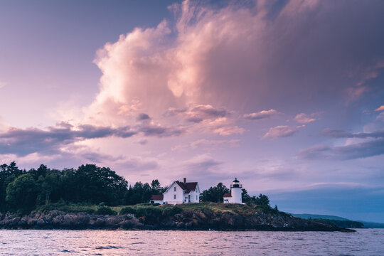 Curtis Island lighthouse off the coast of Camden, Maine at sunset