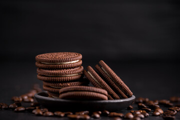 Chocolate chips cookies on black background.