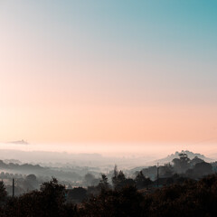 Beautiful landscape with fog and color sky