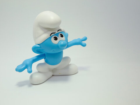 The smurfs. Little blue creatures that live in mushroom houses in the woods. Television characters, movies and comics.