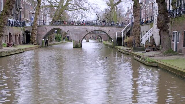 Timelapse fast forward footage from a canal boat cruising under scenic bridges in Utrecht, Netherlands