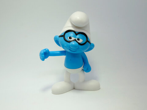 The smurfs. Philosopher. Little blue creatures that live in mushroom houses in the woods. Television characters, movies and comics.