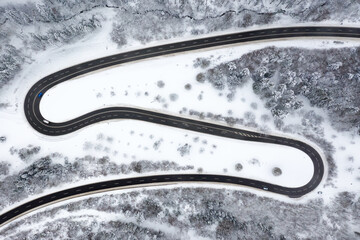 Winter snow winding road Serpentine Switchbacks season aerial photo view