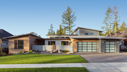 Contemporary luxury home exterior in late afternoon