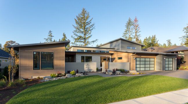 Contemporary luxury home exterior in late afternoon.
