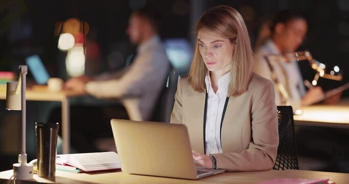 Smart and beautiful caucasian office woman in formal outfit sitting at table solving corporate problems posing at camera. Coworking space. Night office. Portraits.