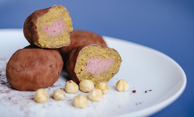 Filled cutaway potato cake on a plate with hazelnuts