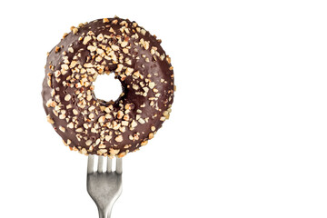 Delicious doughnut covered in chocolate and almond pieces on a fork isolated on white background...