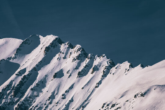 Scenic view of snowcapped mountains against hazy sky, Panticosa, Spain