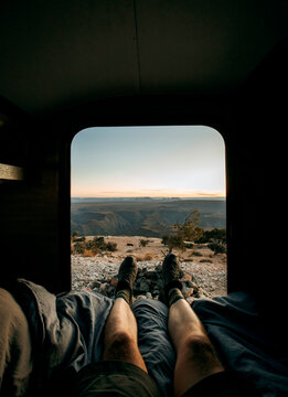 POV view of legs out of camper door looking at desert landscape, utah