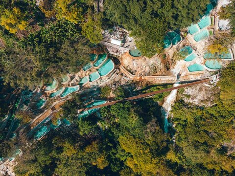 Aerial drone view of bright blue natural hot springs, Tolantongo