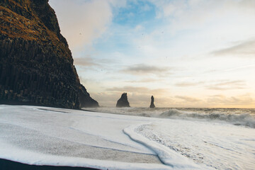 Detail of wave on shore on Reynisfjara black sand beach in Iceland