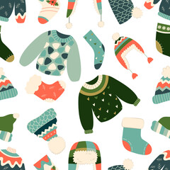 Hand drawn vector illustration of warm winter and autumn woolen sweaters in Scandinavian style, executed as vector seamless pattern. Trendy flat design elements for winter clothes.