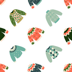 Hand drawn vector illustration of warm winter and autumn woolen sweaters in Scandinavian style, executed as vector seamless pattern. Trendy flat design elements for winter clothes.