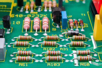 Various electronic components on detail of printed circuit board. Electrotechnics. Close-up of...