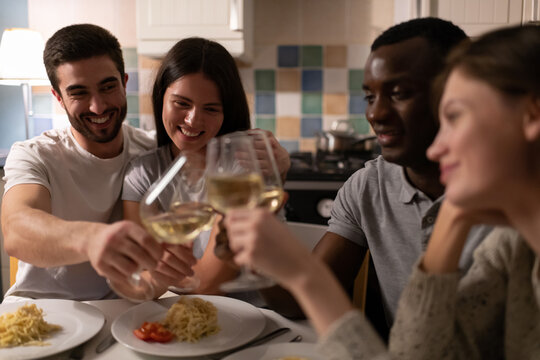 Multiethnic couples enjoying wine together