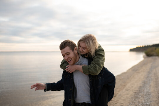 Happy couple having fun with weed joint - Powered by Adobe