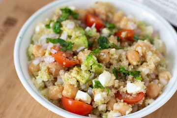 vegan food quinoa with vegetables tomato avocado and  chickpeas