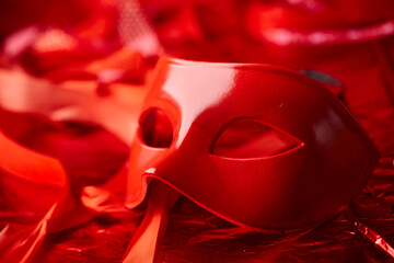 red mask and red ribbons